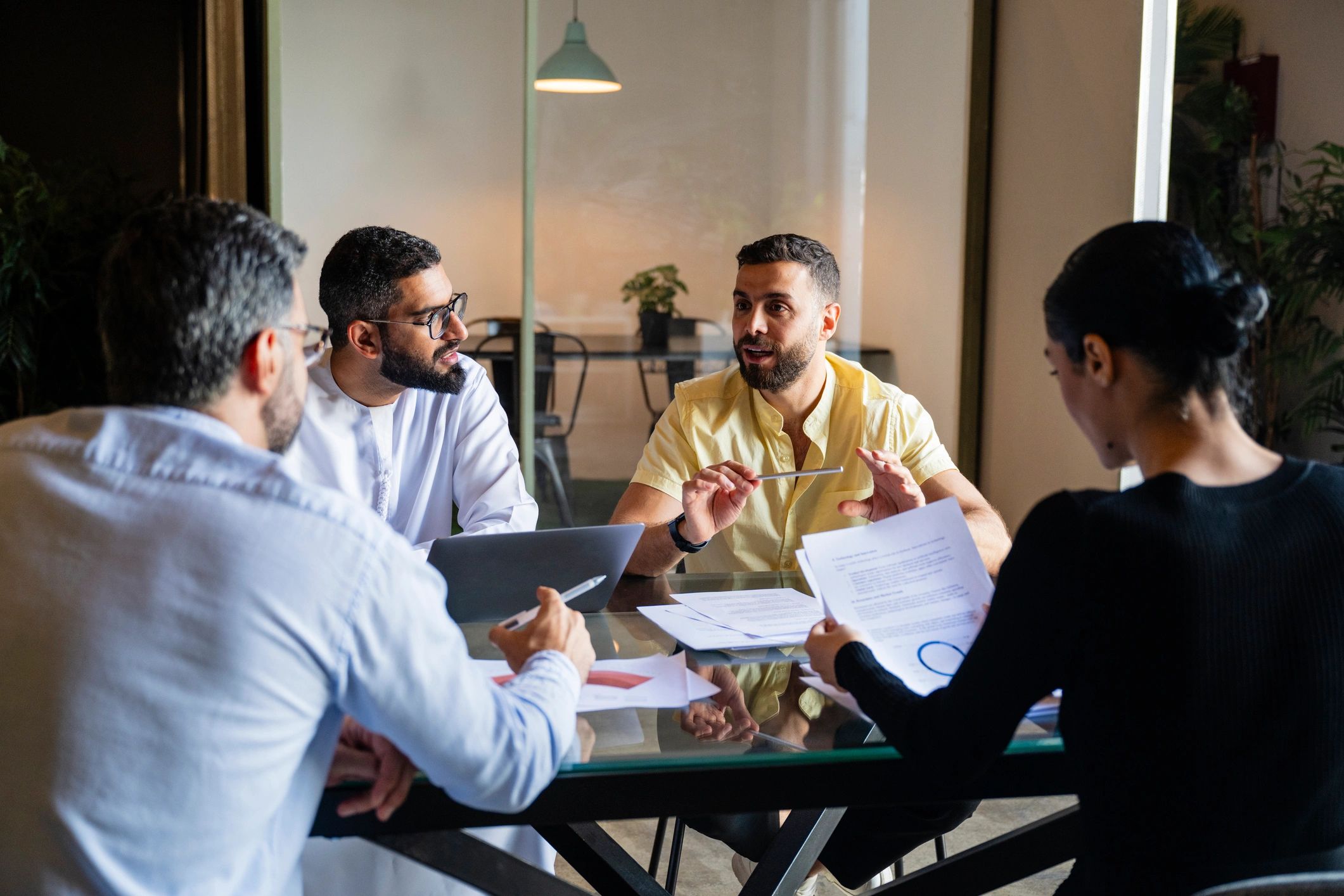 Professional team reviewing documents during a business meeting